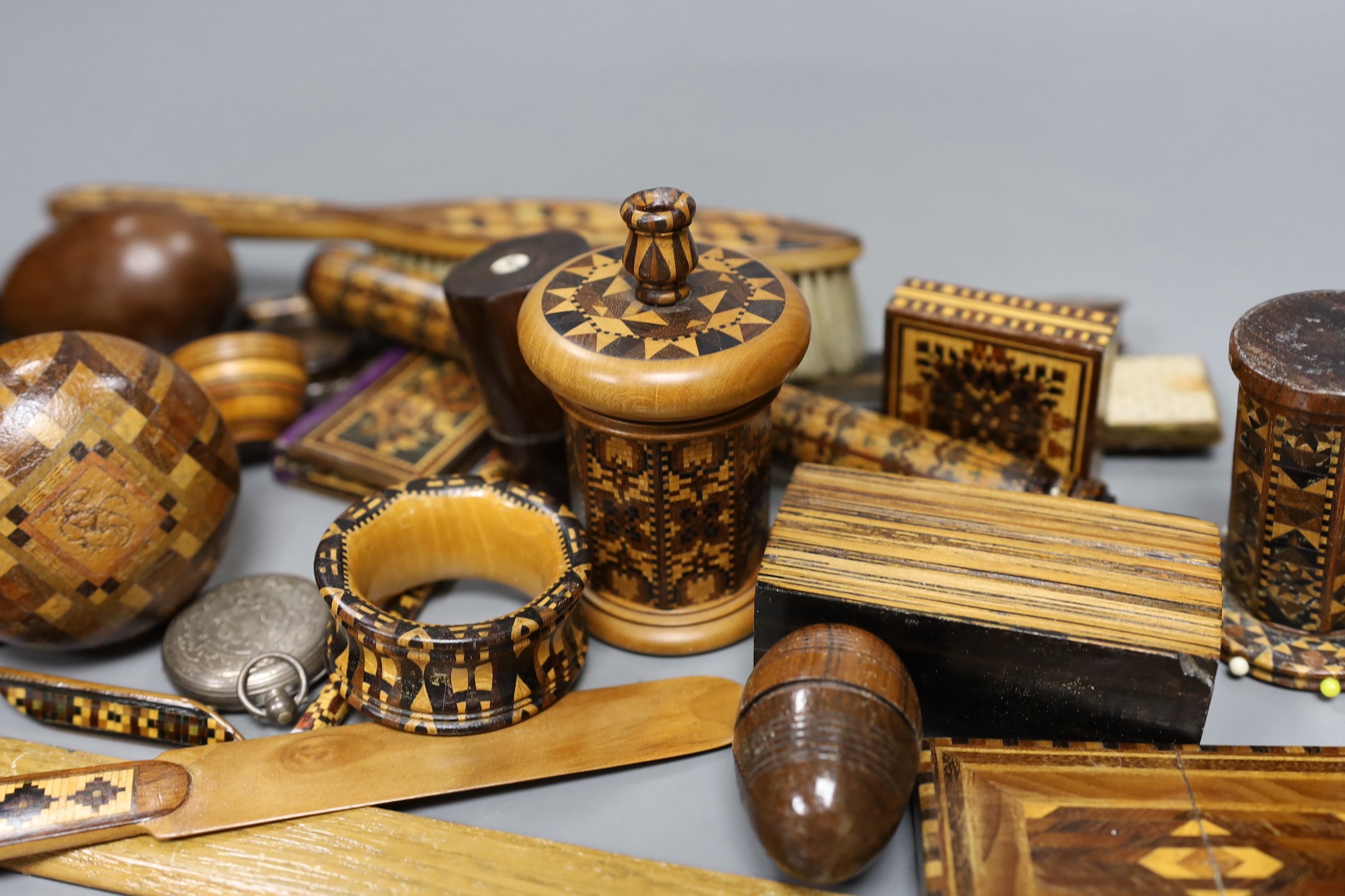 A selection of small Tunbridge ware sewing related items, boxes, letter opener, watch holder, napkin ring, unworked mosaic blocks and other related wood wares